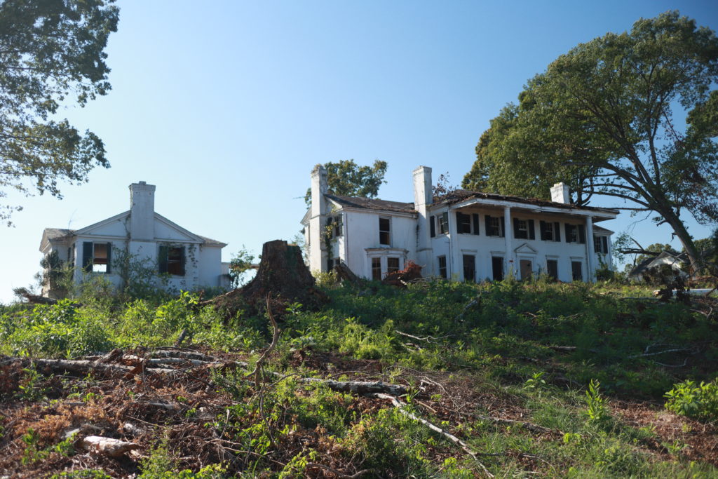 sally abyey rose house, faux antebellum plantation home in ruins at the top of a hill.