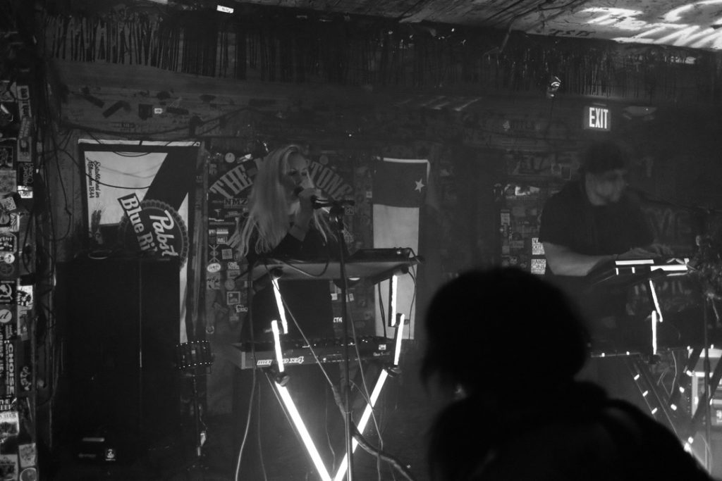 Melanie Foxfire and Scott Sunset of Solemn Shapes on stage at The Milestone Club. B&W Digital Photo. 